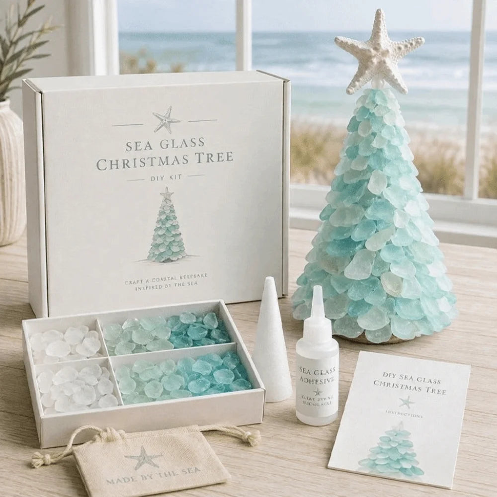 A DIY kit for crafting a sea glass Christmas tree, shown with its white storage box, a completed light blue sea glass tree, a box of sea glass chips, a white cone, a glue bottle, and an instruction card