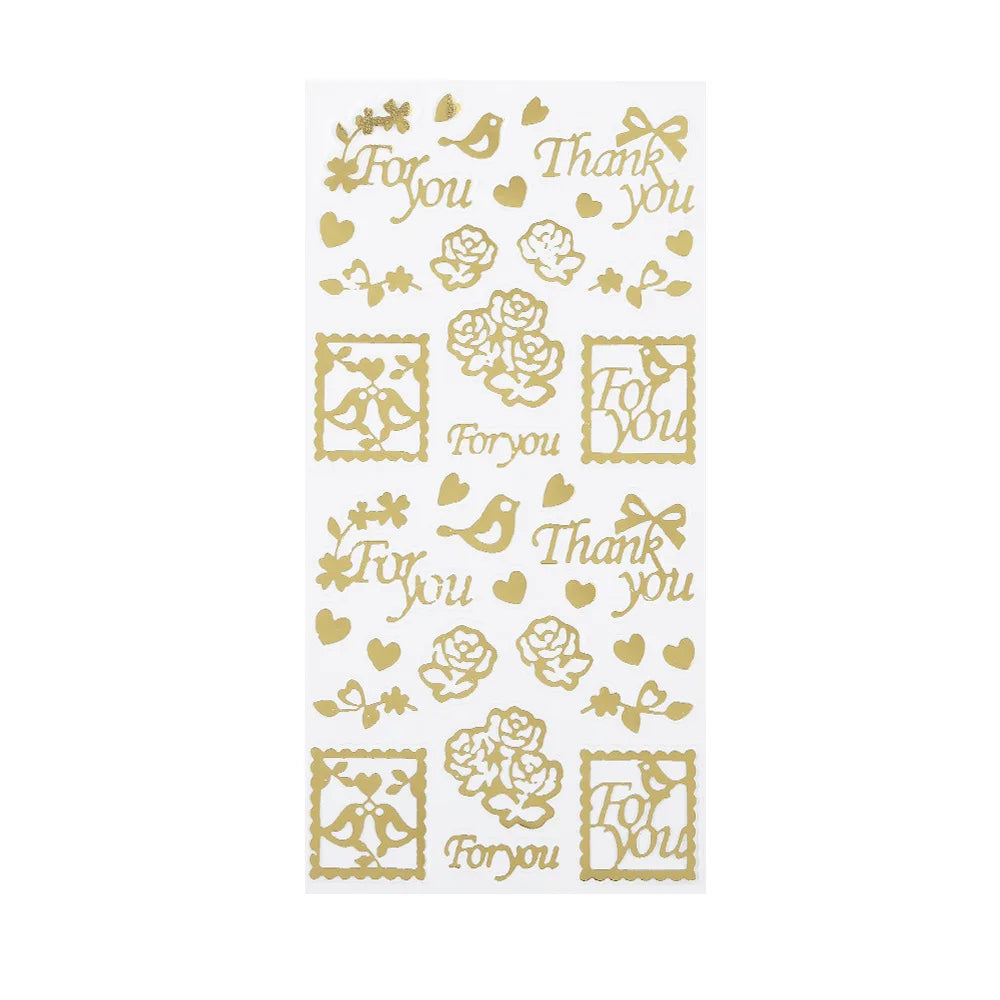 A sheet of decorative stickers featuring gold foil-style designs, including hearts, roses, birds, bows, and the words 'For you' and 'Thank you'.