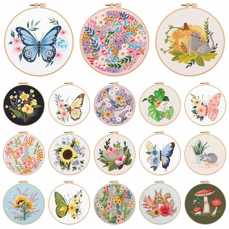 Collection of embroidered hoop art with various designs including butterflies, flowers, and animals on a white background.