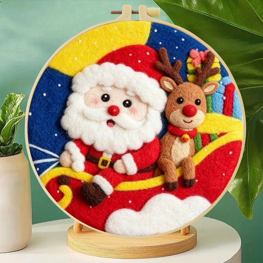 Santa and reindeer in his red sleigh with presents, the night sky, and a full moon in a hoop frame