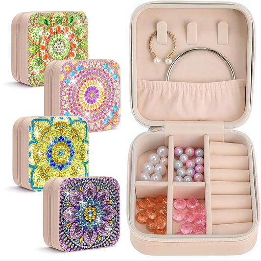 A set of square jewelry organizer cases , including three closed cases with colorful mandala and floral diamond painting patterns, and one open case displaying interior compartments, pearl hooks, ring slots, and storage sections filled with jewelry accessories.