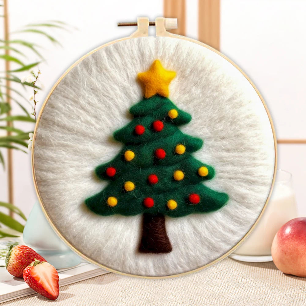 Wool needle felted Christmas tree with a gold star on top on a white backgound