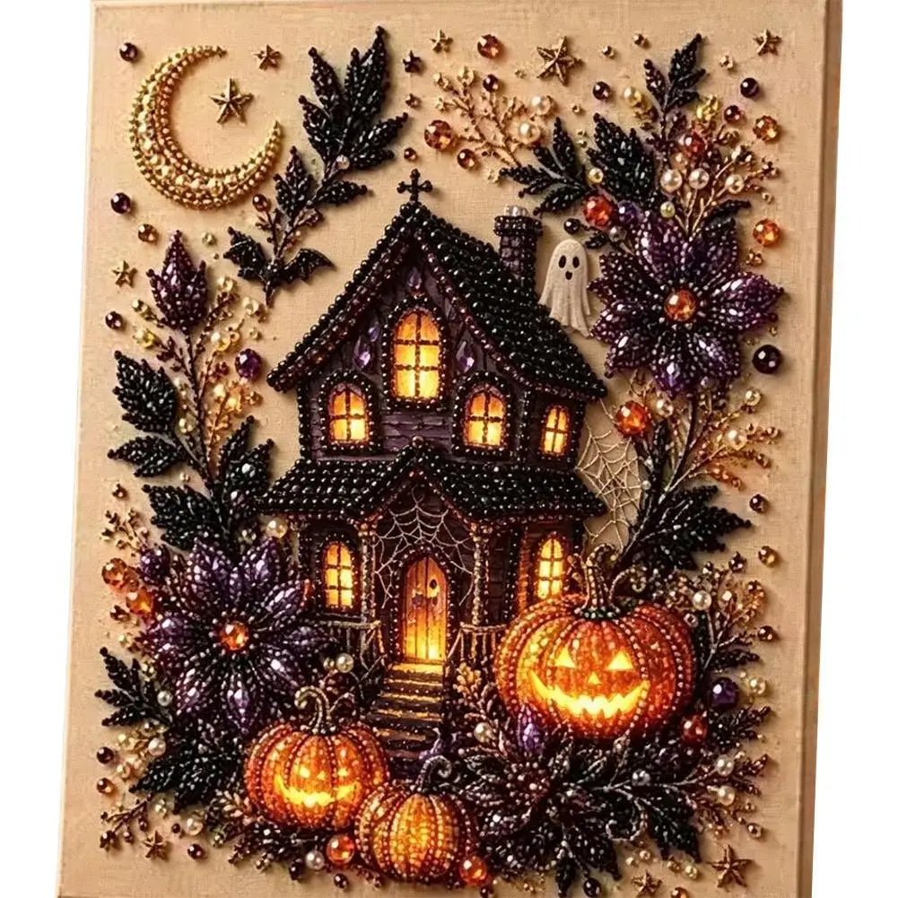 A square beaded canvas art piece featuring a spooky haunted house surrounded by pumpkins, dark leaves, a crescent moon, stars, and a small ghost, all arranged on a light wood background.