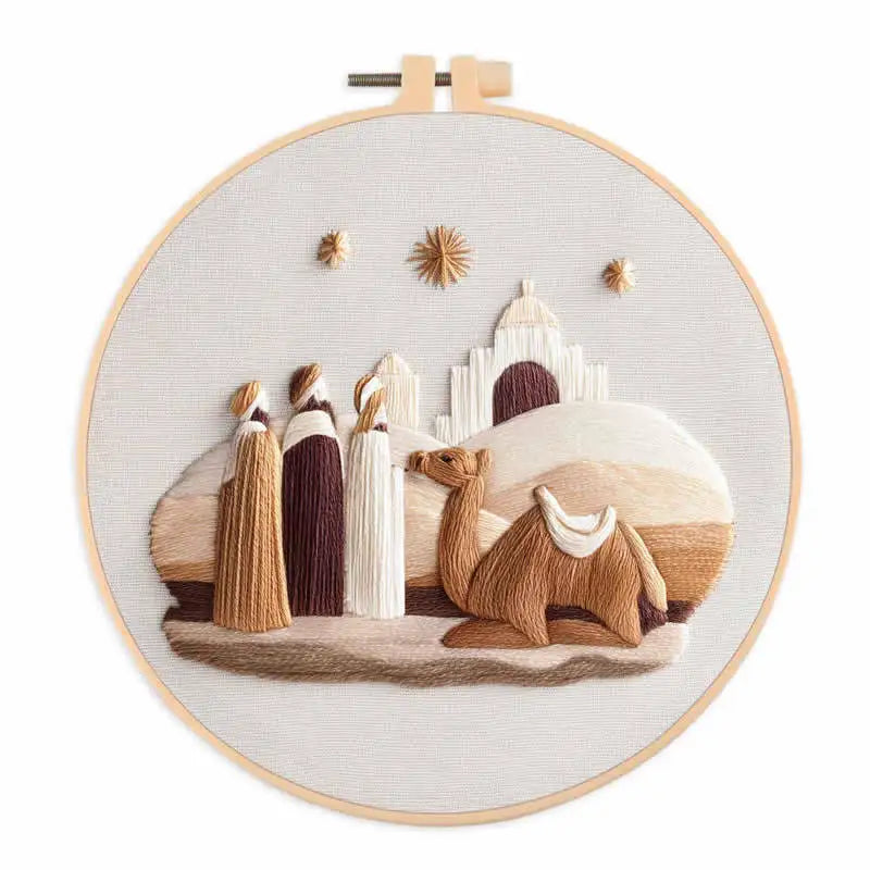 Three Wise Men looking at the stars in the sky, with a camel and mosque in the background  in an embroidery hoop frame