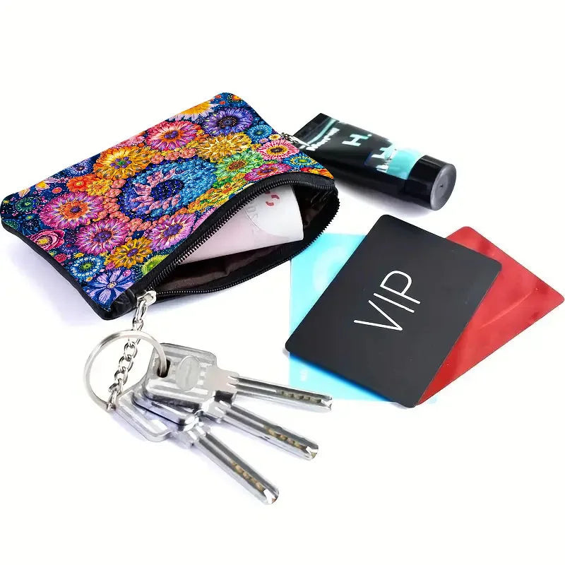 A small zip-around couch with a bright multicolor floral diamond art pattern, shown open with keys on a ring
