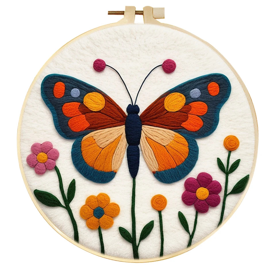 Embroidery hoop with a colorful butterfly and flowers on a white background