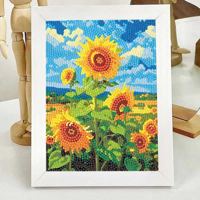A framed diamond painting depicting a sunflower field under a blue sky