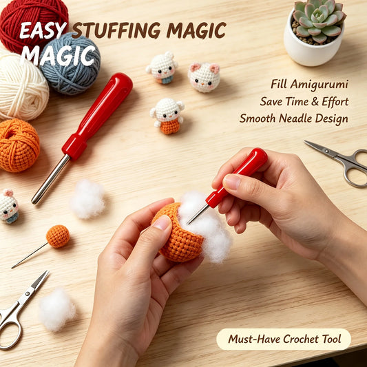 Hands using a red-handled amigurumi stuffing tool to fill white cotton stuffing into an orange crocheted ball, shown on a light wood desk with yarn balls, scissors, a needle, and small crocheted animal figures. Text overlays read 'EASY STUFFING MAGIC' and 'Must-Have Crochet Tool'.