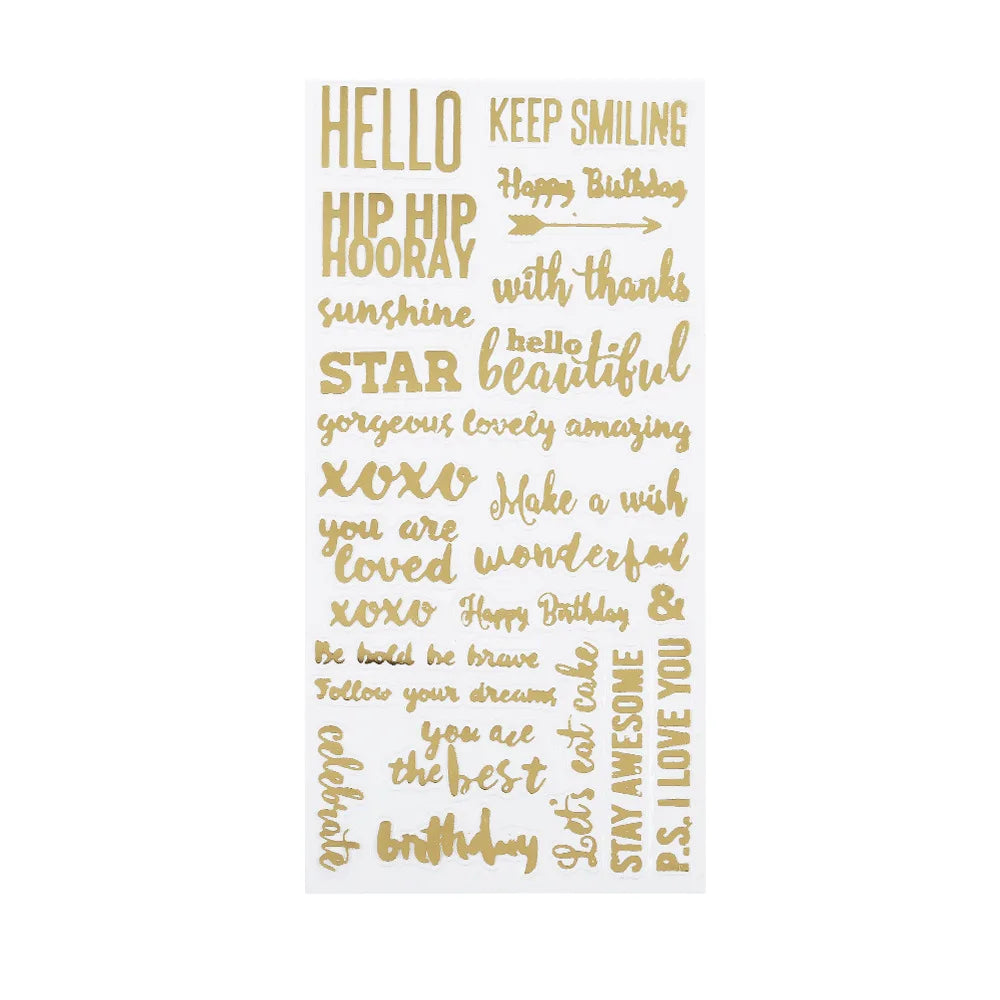 A sheet of clear adhesive stickers printed with various gold-colored inspirational and birthday phrases