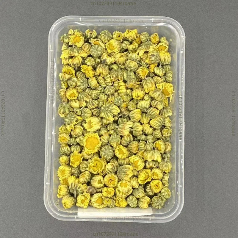 Clear plastic container filled dried chrysanthemum flowers