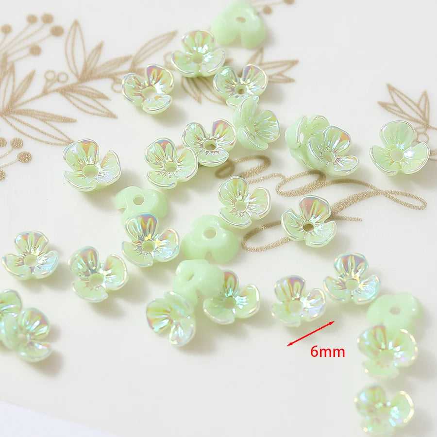 Iridescent green flower-shaped resin 6mm beads 