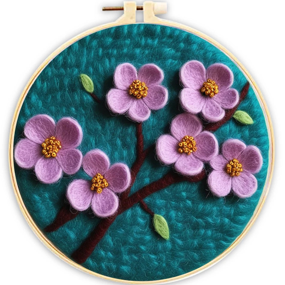 Embroidery hoop with lavendar flowers on a teal background