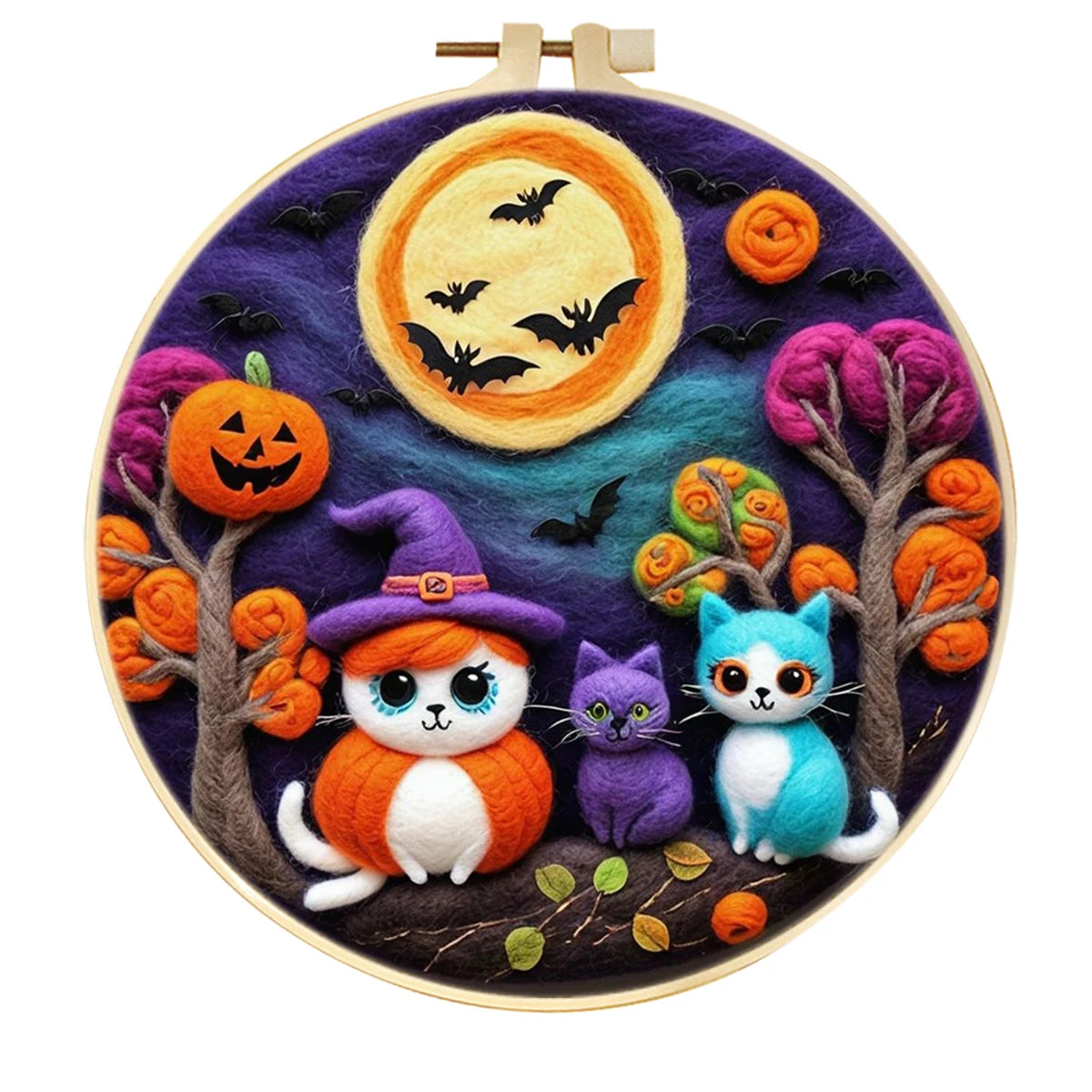 Embroidery hoop with needle felting Halloween-themed cats and pumpkins and bats on a purple background