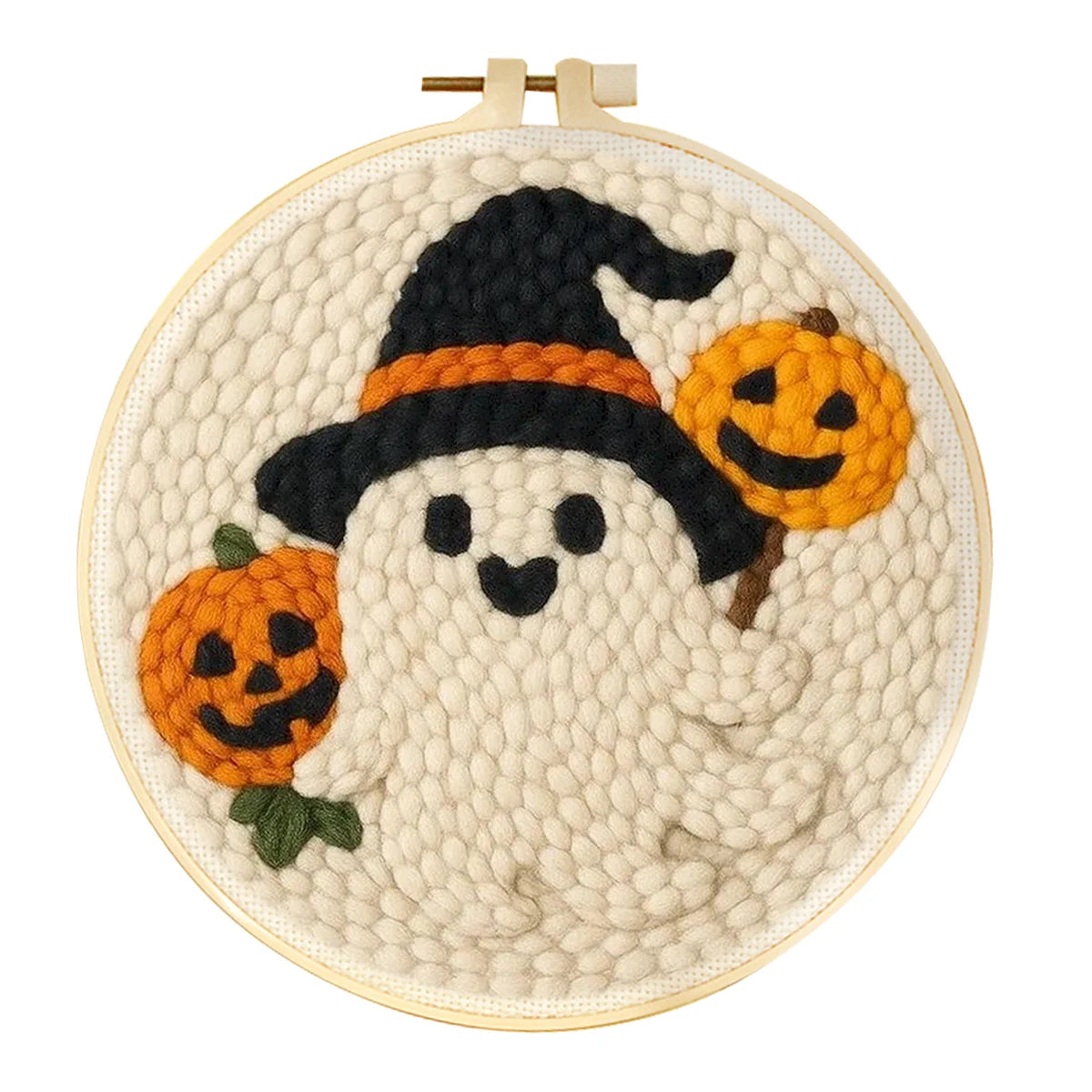 A circular embroidery hoop containing a Halloween-themed punch needle design of a ghost wearing a black witch hat with an orange band and holding two orange jack-o'-lantern pumpkins, on a plain white background.