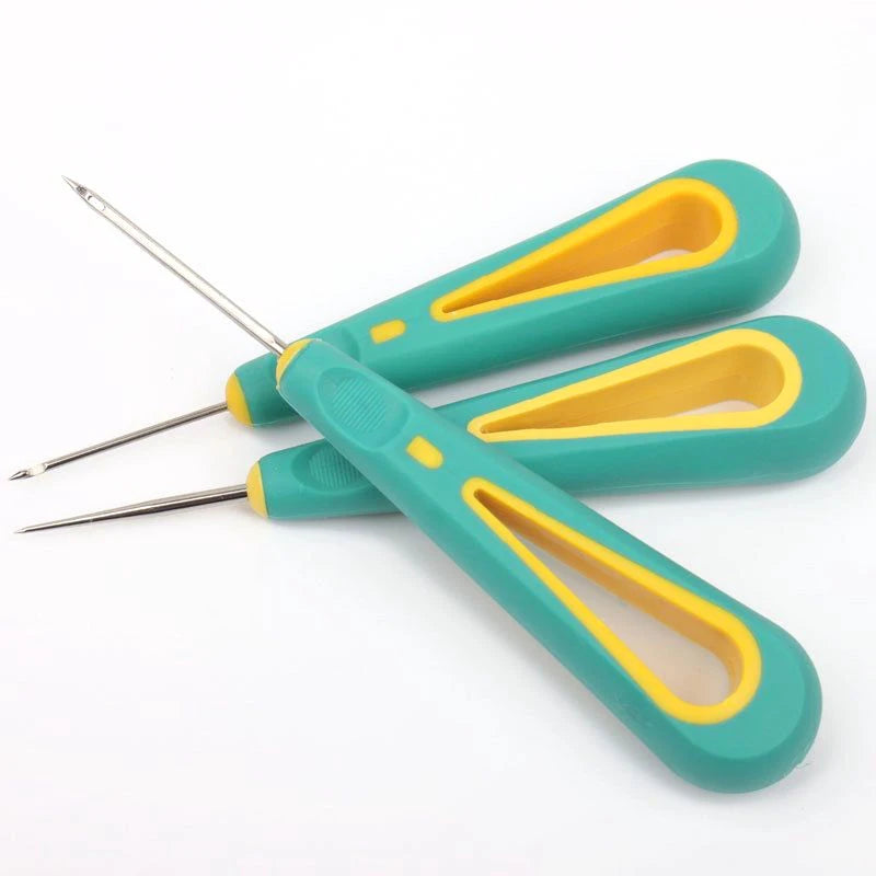 Three candle punch tools for wicks in green and yellow