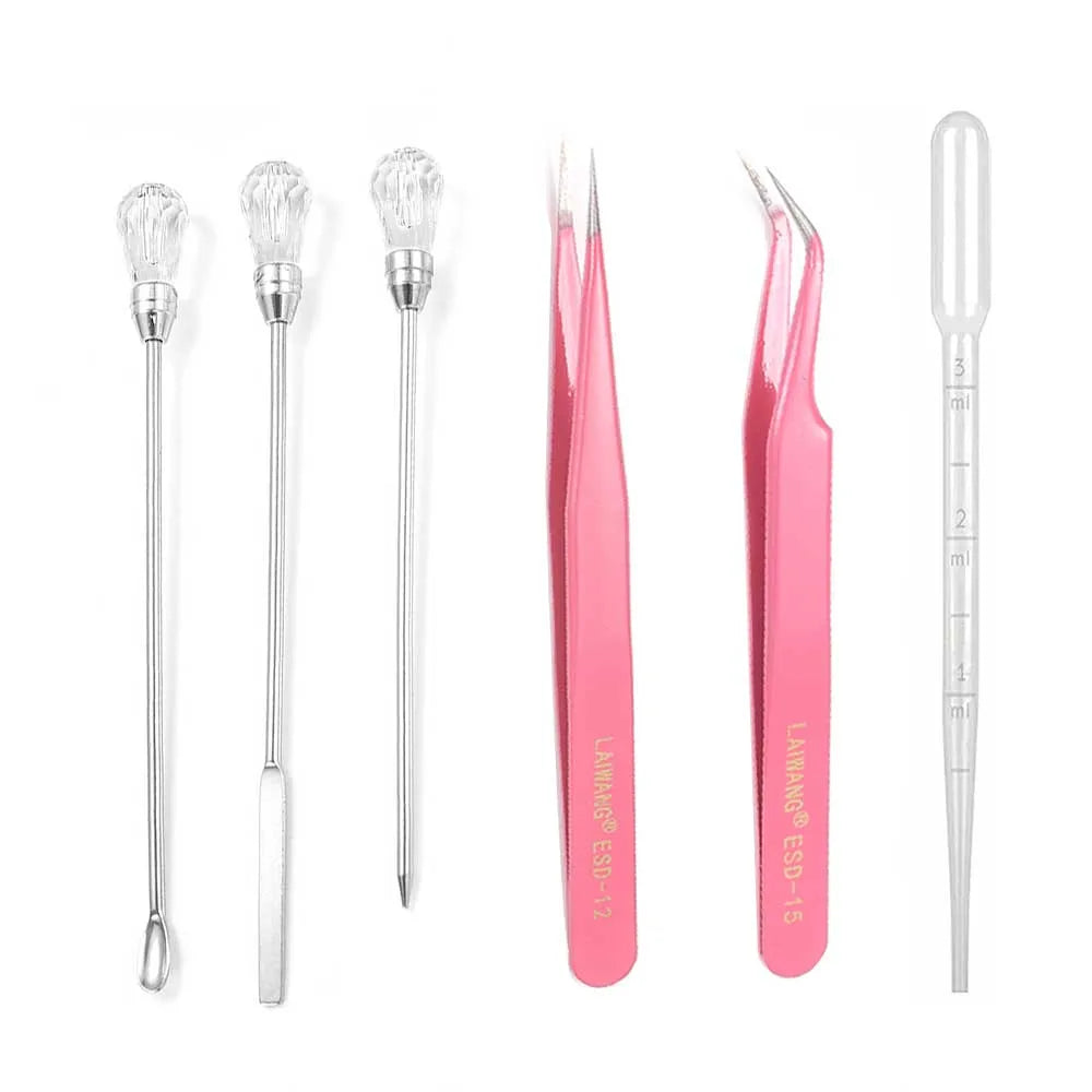 3 resin tools, a pipette, and two tweezers with straight and curved heads