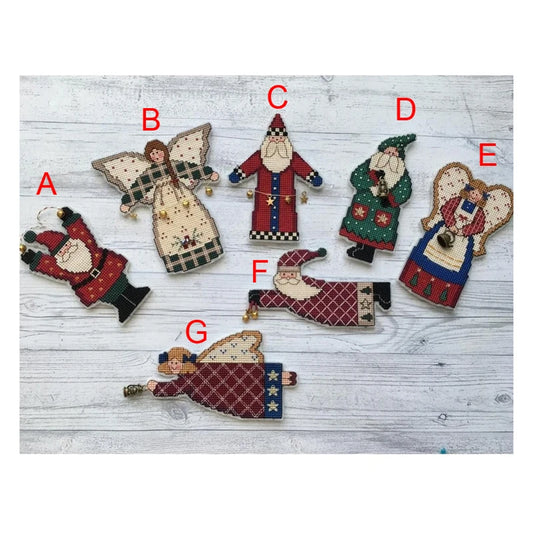 Seven Cross Stitched Christmas figures with Santas and Angels