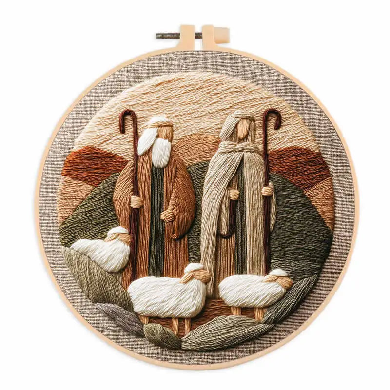 Two shepherds holding staffs, three sheep with hill in the background  in an embroidery hoop frame