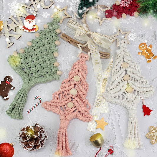 Three macrame knotted Christmas tree ornaments in sage green, dusty pink, and cream white