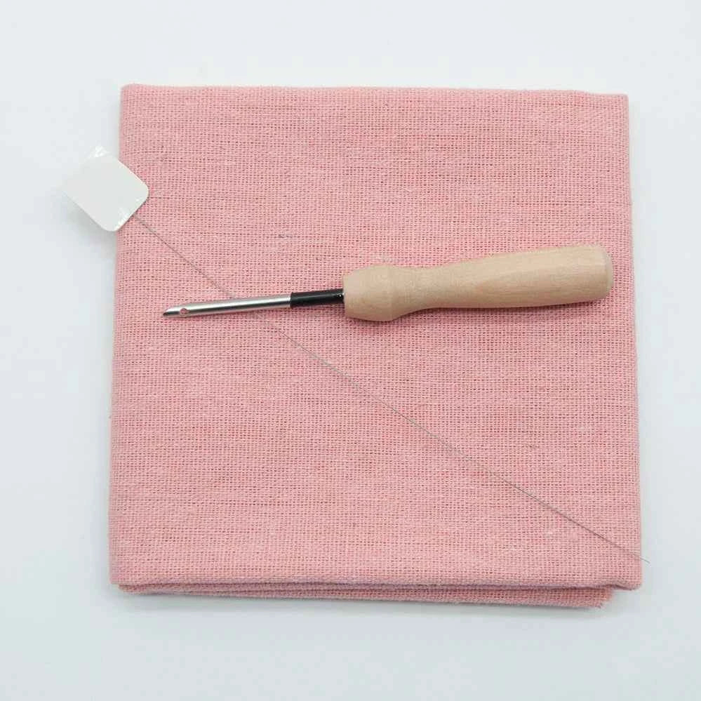 Pink punch needle cotton cloth with a Punch Needle Needle