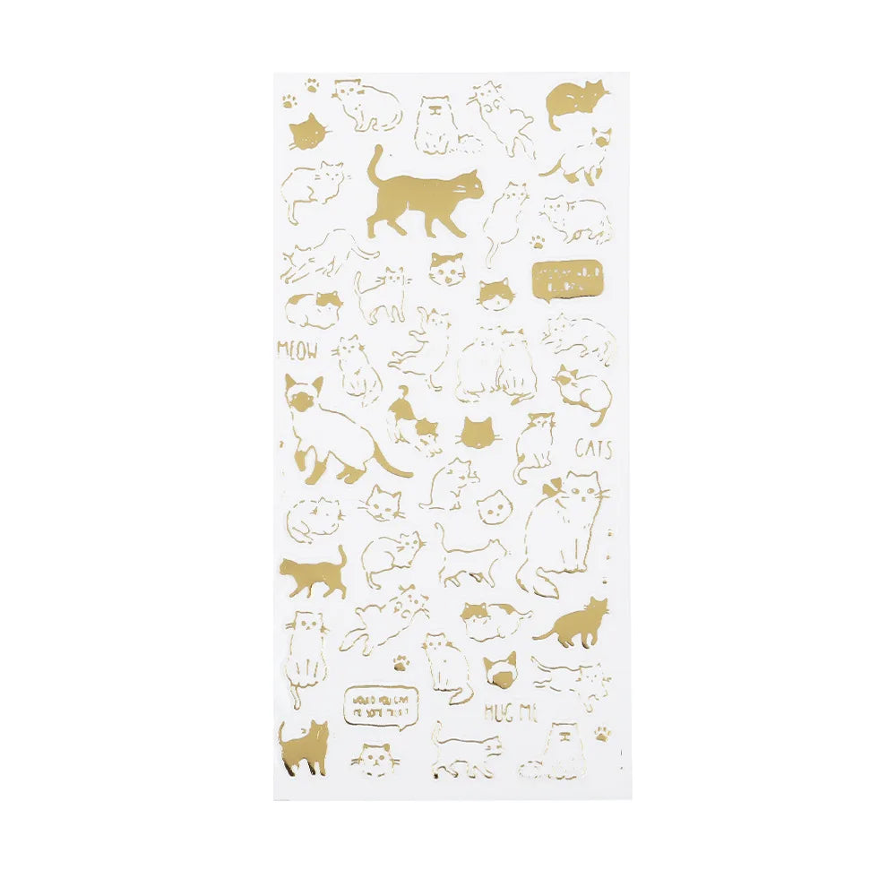 A sheet of translucent  gold stickers featuring various cute gold cat illustrations and text like 'MOON' and 'CATS' 
