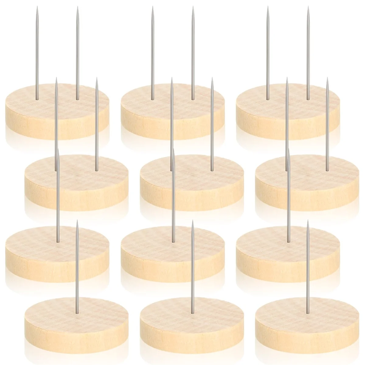 Set of 12 wooden stands for small needle felted or crocheted dolls with metal spikes on a white background