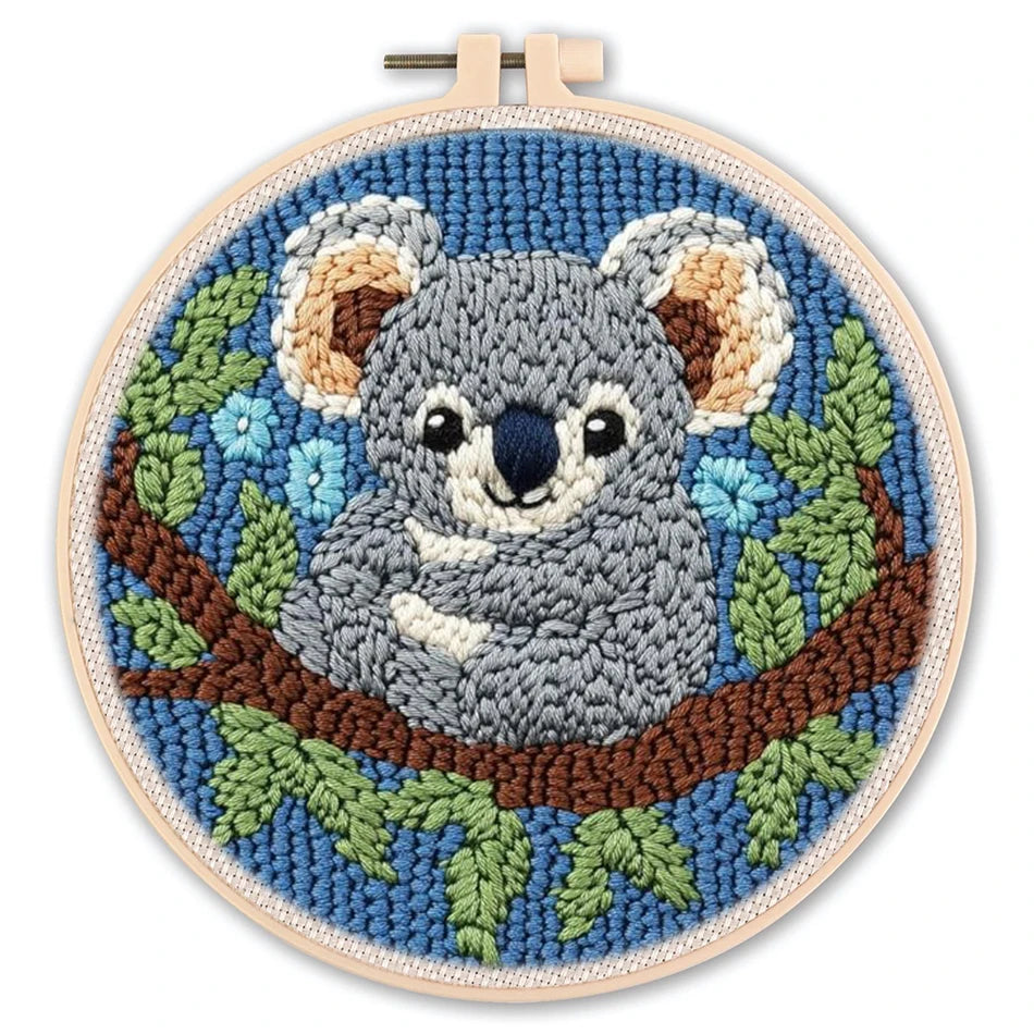 Embroidery hoop with a koala design on a white background