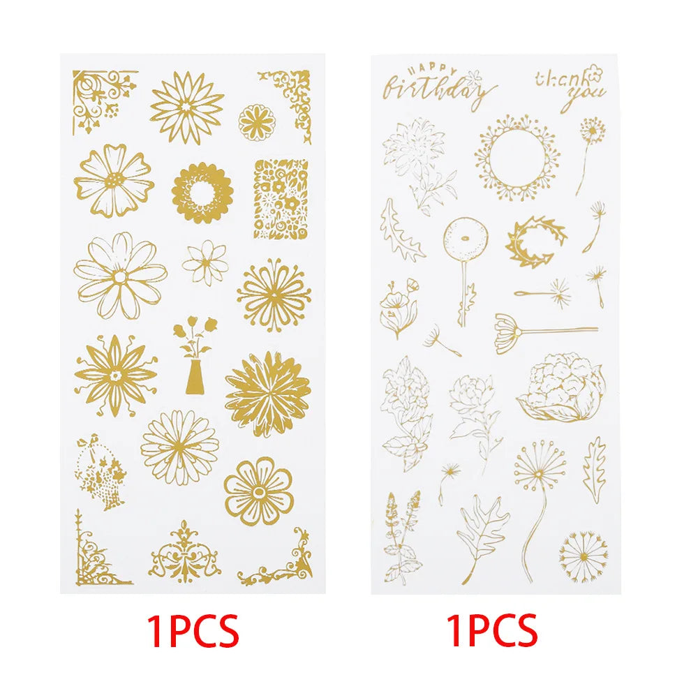 Two sheets of stickers with floral designs shown in gold side by side, with red text below each sheet reading '1PCS'. The left sheet has gold floral and decorative motifs, and the right sheet has gold line-art floral and word designs including 'Happy Birthday' and 'thank you'.