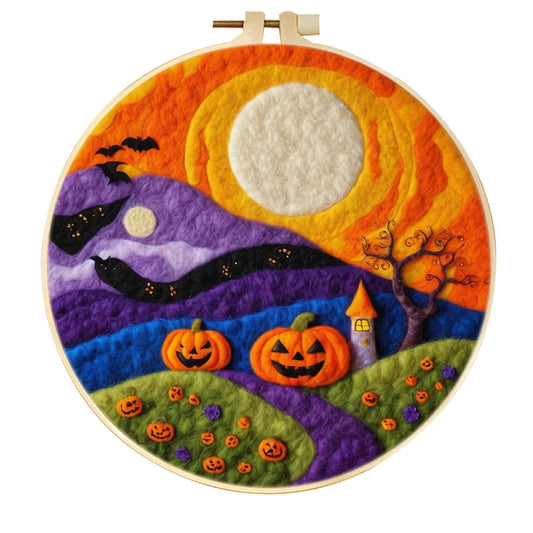 Needle Felted Halloween theme design with a Full moon, jack o'lanterns , pumpkins and bats in an embroidery hoop with an orange background