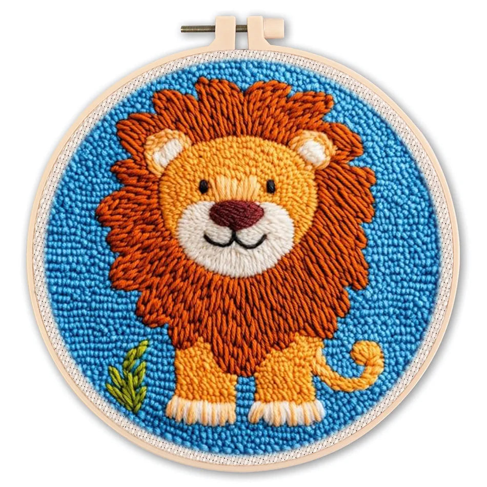Embroidery hoop with a lion design on a blue background