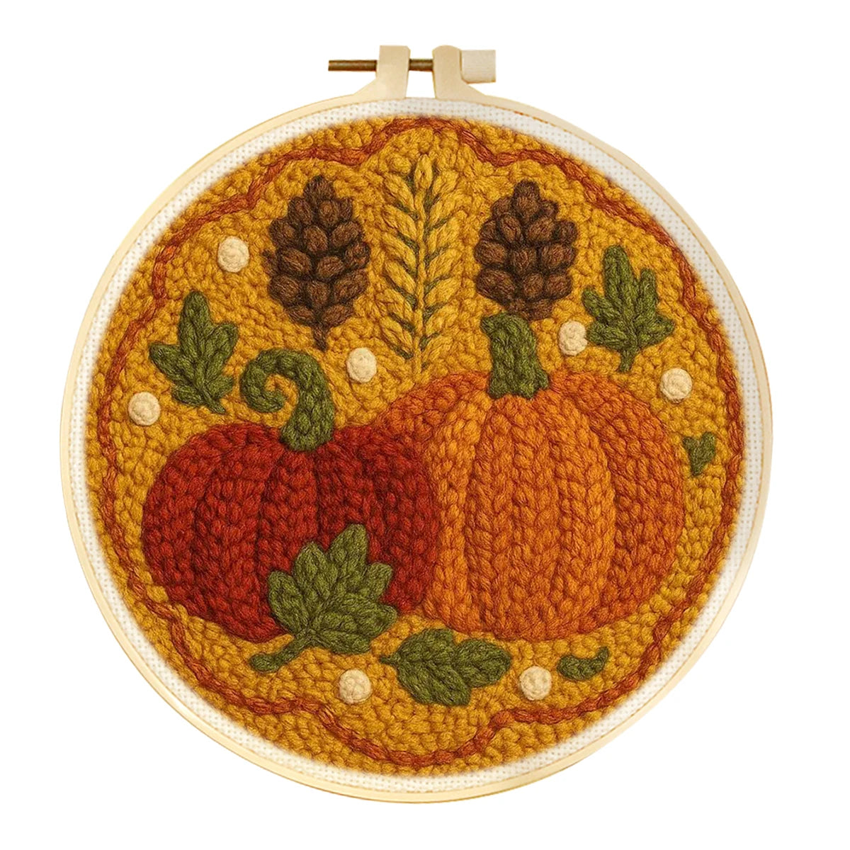 A circular embroidery hoop containing a detailed autumn-themedpunch needle design with two pumpkins, pinecones, leaves, and a leafy background in warm fall colors.